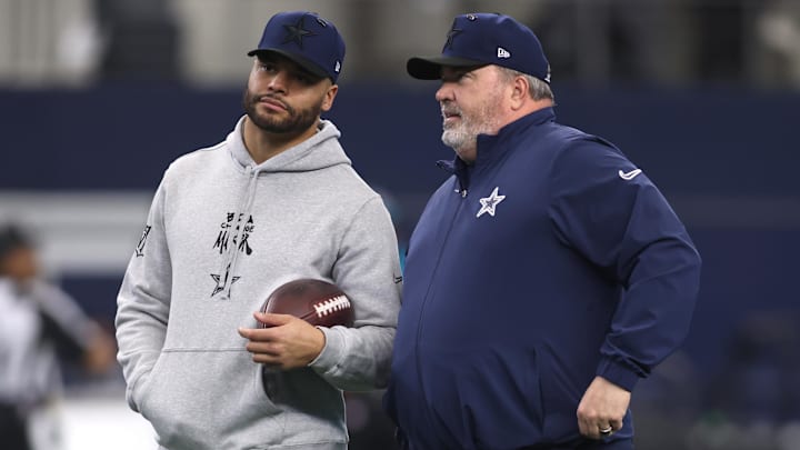 Jan 5, 2025; Arlington, Texas, USA; Dallas Cowboys quarterback Dak Prescott (4) talks to head coach Mike McCarthy before the game against the Washington Commanders at AT&T Stadium. Mandatory Credit: Tim Heitman-Imagn Images