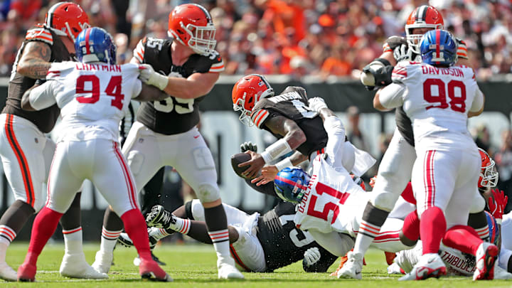 Cleveland Browns quarterback Deshaun Watson (4) is sacked by New York Giants linebacker Azeez Ojulari (51) during the second half of an NFL football game at Huntington Bank Field, Sunday, Sept. 22, 2024, in Cleveland, Ohio.