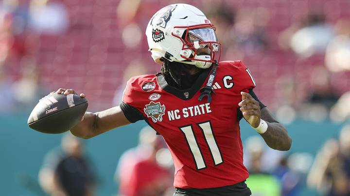 Dec 19, 2025; Tampa, FL, USA; NC State Wolfpack quarterback CJ Bailey (11) throws a pass against the Memphis Tigers in the first quarter during the Gasparilla Bowl at Raymond James Stadium. Mandatory Credit: Nathan Ray Seebeck-Imagn Images Dec 19, 2025; Tampa, FL, USA; NC State Wolfpack quarterback CJ Bailey (11) throws a pass against the Memphis Tigers in the first quarter during the Gasparilla Bowl at Raymond James Stadium. Mandatory Credit: Nathan Ray Seebeck-Imagn Images