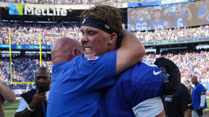 New York Giants quarterback Jaxson Dart (6) gets a hug from head coach Brian Daboll after defeating the Los Angeles Chargers at MetLife Stadium, Sep 28, 2025, East Rutherford, NJ, USA.