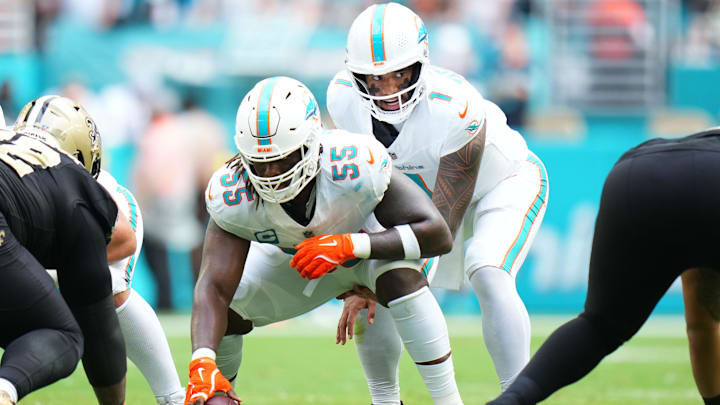 Miami Dolphins quarterback Tua Tagovailoa (1) under center Aaron Brewer (55) against the New Orleans Saints during the first half at Hard Rock Stadium. 