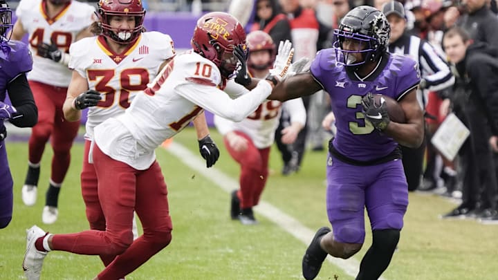Nov 26, 2022; Fort Worth, Texas, USA; TCU Horned Frogs running back Emari Demercado (3) is knocked out of bounds by Iowa State Cyclones defensive back Darien Porter (10) after a 62-yard kick off return during the first half 