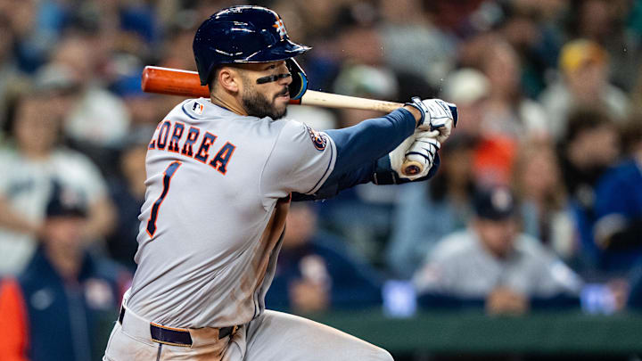 Apr 11, 2026; Seattle, Washington, USA; Houston Astros third baseman Carlos Correa (1) breaks his bat a hits single during the third inning against the Seattle Mariners at T-Mobile Park. Mandatory Credit: Stephen Brashear-Imagn Images