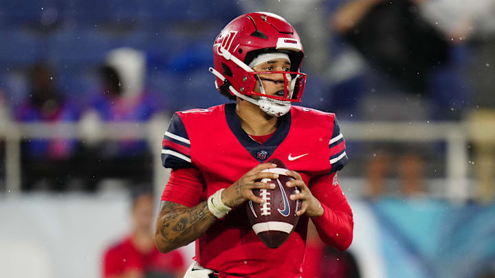 Dec 20, 2022; Boca Raton, Florida, USA; Liberty Flames quarterback Kaidon Salter (7) drops back to pass against the Toledo Rockets during the second quarter in the 2022 Boca Raton Bowl at FAU Stadium. Mandatory Credit: Rich Storry-Imagn Images