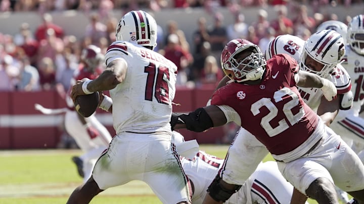 Oct 12, 2024; Tuscaloosa, Alabama, USA;  South Carolina Gamecocks quarterback LaNorris Sellers (16) evades a rush by Alabama Crimson Tide defensive lineman LT Overton (22) at Bryant-Denny Stadium. Alabama defeated South Carolina 27-25.