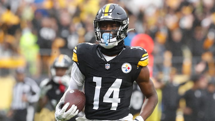 Oct 29, 2023; Pittsburgh, Pennsylvania, USA;  Pittsburgh Steelers wide receiver George Pickens (14) runs to score a touchdown on a pass reception against the Jacksonville Jaguars during the third quarter at Acrisure Stadium. Jacksonville won 20-10. Mandatory Credit: Charles LeClaire-USA TODAY Sports