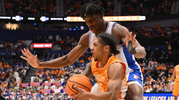 Mar 16, 2025; Nashville, TN, USA; Tennessee Volunteers guard Zakai Zeigler (5) attempts to shoot the ball against Florida Gators center Rueben Chinyelu (9) in the second half during the 2025 SEC Championship Game at Bridgestone Arena. Mandatory Credit: Steve Roberts-Imagn Images