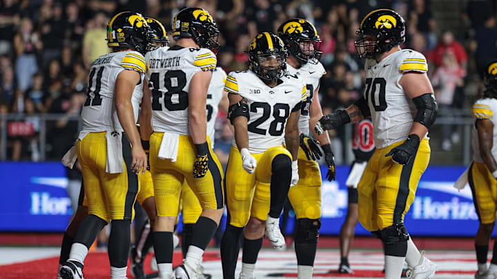 Sep 19, 2025; Piscataway, New Jersey, USA; Iowa Hawkeyes running back Kamari Moulton (28) celebrates his rushing touchdown with teammates during the first half against the Rutgers Scarlet Knights at SHI Stadium. Mandatory Credit: Vincent Carchietta-Imagn Images
