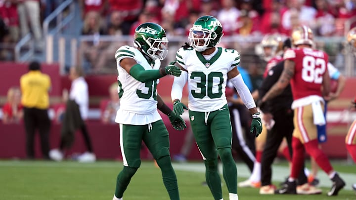 Sep 9, 2024; Santa Clara, California, USA; New York Jets safety Chuck Clark (left) congratulates cornerback Michael Carter II (30) during the first quarter against the San Francisco 49ers at Levi's Stadium. Mandatory Credit: Darren Yamashita-Imagn Images