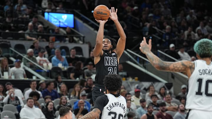 Mar 4, 2025; San Antonio, Texas, USA;  Brooklyn Nets guard Cam Thomas (24) shoots over San Antonio Spurs forward Julian Champagnie (30) in the second half at Frost Bank Center. Mandatory Credit: Daniel Dunn-Imagn Images