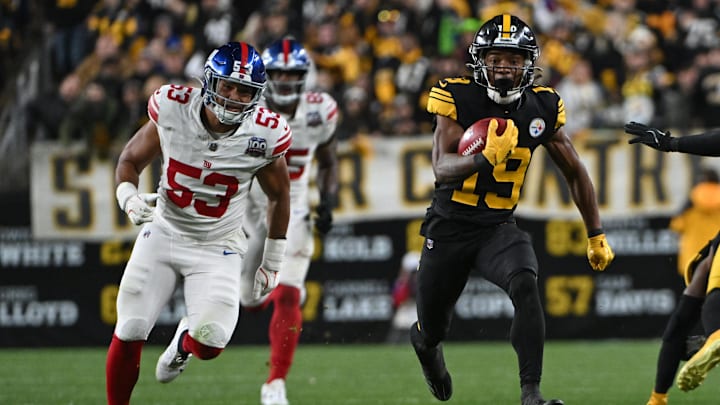 Oct 28, 2024; Pittsburgh, Pennsylvania, USA; Pittsburgh Steelers Calvin Austin III (19) returns a punt for a 73-yard touchdown as New York Giants linebacker Darius Muasau (53) gives chase during the third quarter at Acrisure Stadium.  