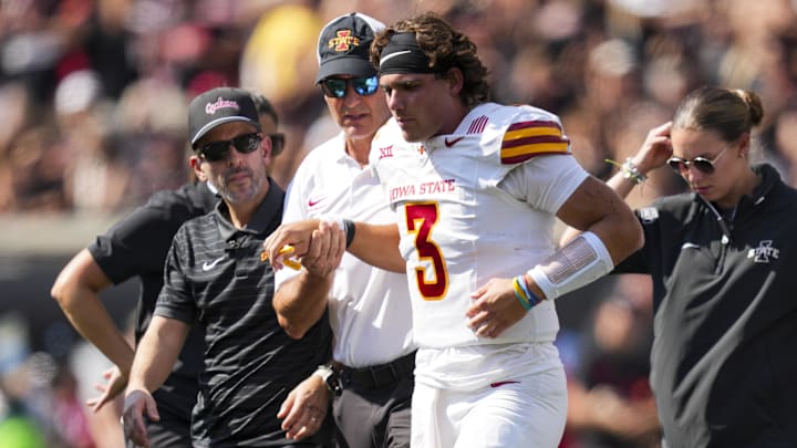 Oct 4, 2025; Cincinnati, Ohio, USA;  Iowa State Cyclones quarterback Rocco Becht (3) is helped off the field during a stop in play against the Cincinnati Bearcats in the first half at Nippert Stadium. 