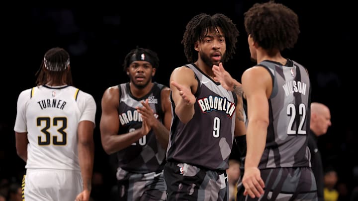 Dec 4, 2024; Brooklyn, New York, USA; Brooklyn Nets forwards Trendon Watford (9) and Jalen Wilson (22) and center Day'Ron Sharpe (20) celebrate during the fourth quarter against the Indiana Pacers at Barclays Center. Mandatory Credit: Brad Penner-Imagn Images