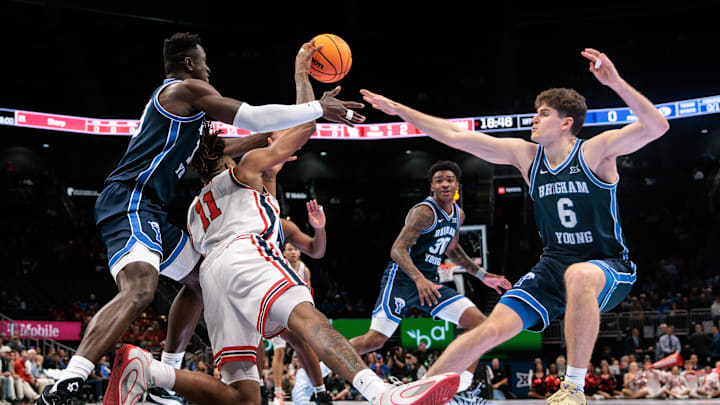 Mar 12, 2026; Kansas City, MO, USA; BYU Cougars forward AJ Dybantsa (3) BYU Cougars guard Aleksej Kostic (6) and Houston Cougars forward Joseph Tugler (11) go after a loose ball during the first half at T-Mobile Center. Mandatory Credit: William Purnell-Imagn Images
