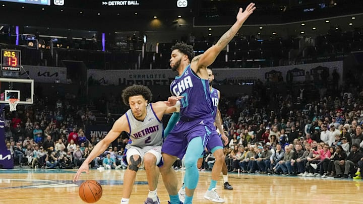 Feb 27, 2022; Charlotte, North Carolina, USA; Detroit Pistons guard Cade Cunningham (2) tries to get