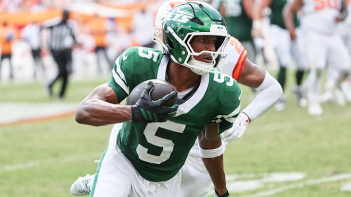 New York Jets wide receiver Garrett Wilson runs with the ball against the Tampa Bay Buccaneers. New York Jets wide receiver Garrett Wilson runs with the ball against the Tampa Bay Buccaneers.