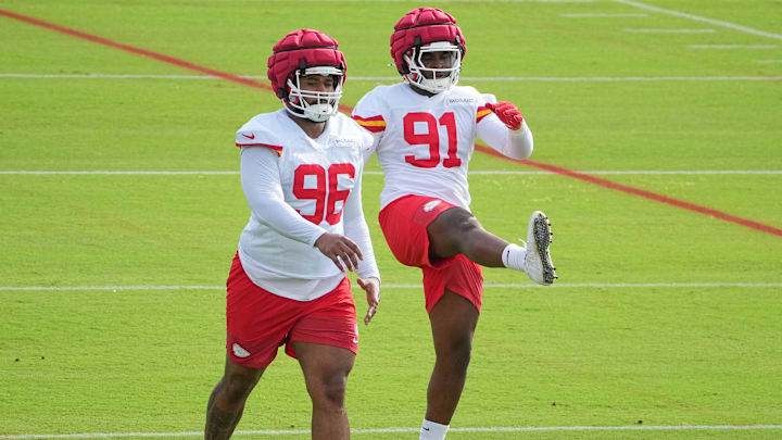 Jul 22, 2025; St. Joseph, MO, USA; Kansas City Chiefs defensive tackle Fabien Lovett Sr. (96) and defensive end Felix Anudike-Uzomah (91) stretch out during training camp at Missouri Western State University. Mandatory Credit: Denny Medley-Imagn Images
