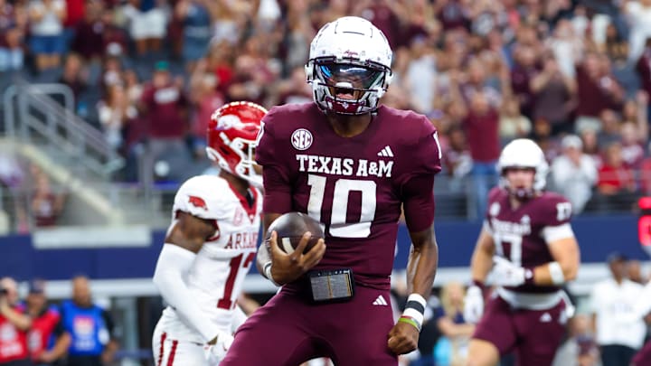 Sep 28, 2024; Arlington, Texas, USA; Texas A&M Aggies quarterback Marcel Reed (10) reacts after scoring a touchdown during the first half against the Arkansas Razorbacks at AT&T Stadium. Mandatory Credit: Kevin Jairaj-Imagn Images Sep 28, 2024; Arlington, Texas, USA; Texas A&M Aggies quarterback Marcel Reed (10) reacts after scoring a touchdown during the first half against the Arkansas Razorbacks at AT&T Stadium. Mandatory Credit: Kevin Jairaj-Imagn Images