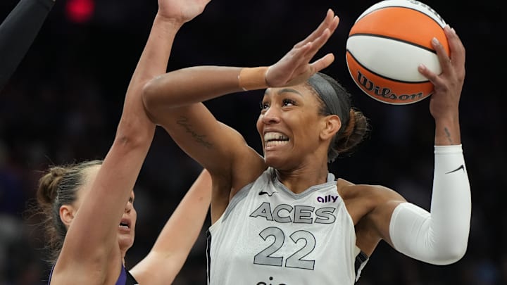Aug 15, 2025; Phoenix, Arizona, USA; Las Vegas Aces center A'ja Wilson (22) shoots over Phoenix Mercury guard Sami Whitcomb (33) in the first half at Footprint Center. 