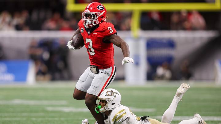 Nov 28, 2025; Atlanta, Georgia, USA; Georgia Bulldogs running back Nate Frazier (3) is tackled by Georgia Tech Yellow Jackets defensive back Fenix Felton (31) in the second quarter at Mercedes-Benz Stadium. Mandatory Credit: Brett Davis-Imagn Images