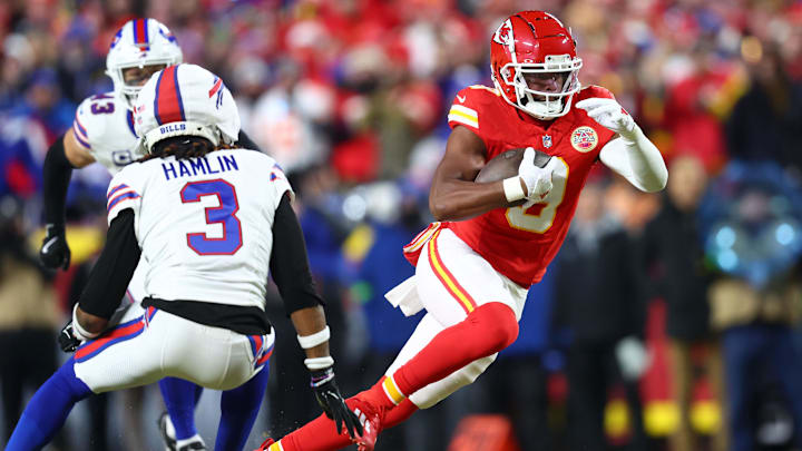 Jan 26, 2025; Kansas City, MO, USA; Kansas City Chiefs wide receiver JuJu Smith-Schuster (9) makes a catch against Buffalo Bills safety Damar Hamlin (3) during the first quarter in the AFC Championship game at GEHA Field at Arrowhead Stadium. Mandatory Credit: Mark J. Rebilas-Imagn Images