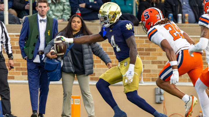 Nov 22, 2025; South Bend, Indiana, USA; Notre Dame Fighting Irish running back Jeremiyah Love (4) scores a touchdown against the Syracuse Orange during the first half at Notre Dame Stadium. Mandatory Credit: Michael Caterina-Imagn Images