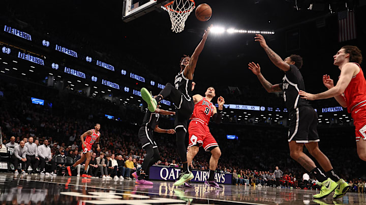 Brooklyn Nets forward Dorian Finney-Smith (28) and Chicago Bulls center Nikola Vucevic (9) during the first half at Barclays Center. 