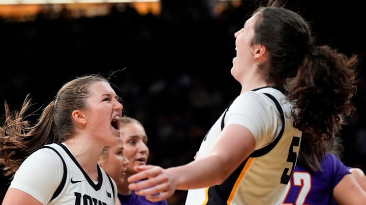 Iowa guard Taylor Stremlow (1) and Iowa center Ava Heiden (5) react Nov. 9, 2025 during a women’s basketball game against the Evansville Purple Aces at Carver-Hawkeye Arena in Iowa City, Iowa.