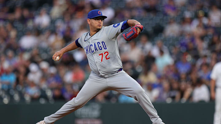 Denver, Colorado, USA; Chicago Cubs starting pitcher Javier Assad (72) pitches in the first inning against the Colorado Rockies at Coors Field.