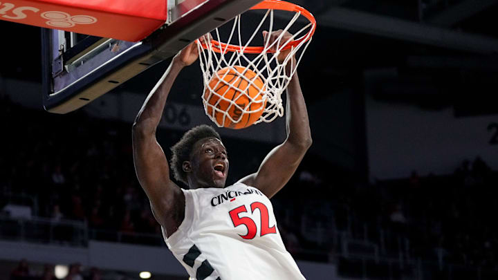 Cincinnati Bearcats center Moustapha Thiam (52) dunks in the first half of the NCAA men’s basketball game between the Cincinnati Bearcats and the NJIT Highlanders at Fifth Third Arena in Cincinnati on Monday, Nov. 24, 2025.