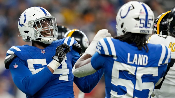 Indianapolis Colts defensive end Dayo Odeyingbo (54) and Indianapolis Colts defensive end Isaiah Land (55) celebrate a sack Sunday, Sept. 29, 2024, during a game against the Pittsburgh Steelers at Lucas Oil Stadium in Indianapolis.