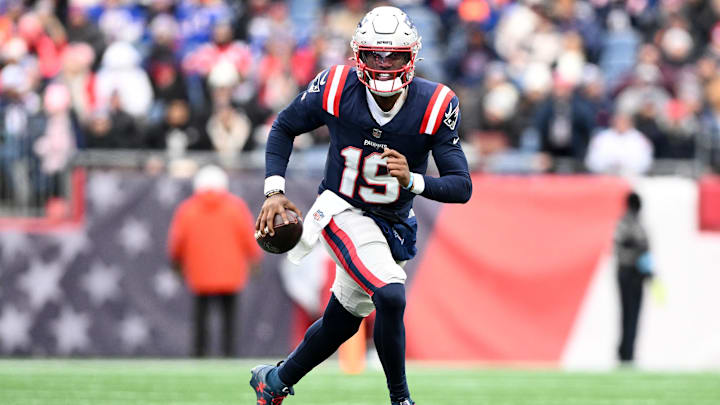 Jan 5, 2025; Foxborough, Massachusetts, USA; New England Patriots quarterback Joe Milton III (19) runs against the Buffalo Bills during the first half at Gillette Stadium. Mandatory Credit: Brian Fluharty-Imagn Images