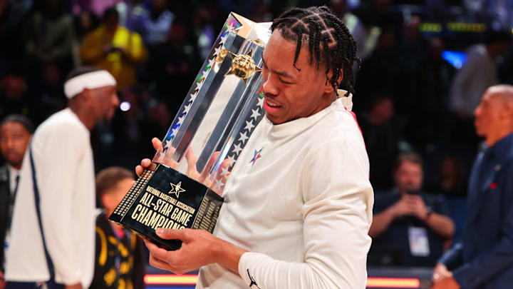 Scottie Barnes holding the 2024 NBA All-Star Game Trophy