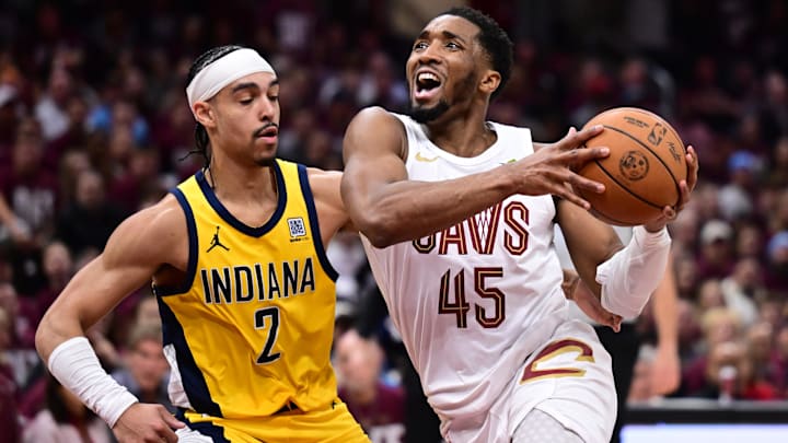 May 4, 2025; Cleveland, Ohio, USA; Cleveland Cavaliers guard Donovan Mitchell (45) drives to the basket against Indiana Pacers guard Andrew Nembhard (2) during the second half in game one of the second round for the 2025 NBA Playoffs at Rocket Arena. Mandatory Credit: Ken Blaze-Imagn Images