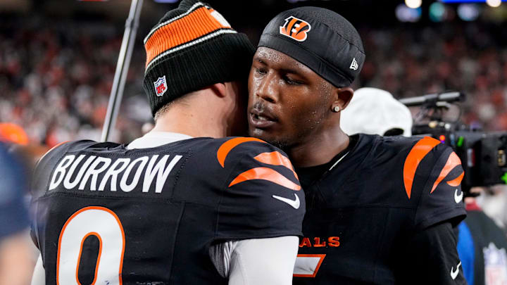 Cincinnati Bengals quarterback Joe Burrow (9) and wide receiver Tee Higgins (5) celebrate the win after overtime of the NFL Week 17 game between the Cincinnati Bengals and the Denver Broncos at Paycor Stadium in downtown Cincinnati on Saturday, Dec. 28, 2024. The Bengals took a 30-24 win in overtime to remain in the post season chase.