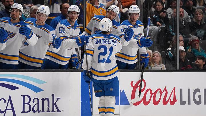 Mar 6, 2026; San Jose, California, USA; St. Louis Blues right winger Jimmy Snuggerud (21) scores a goal against the San Jose Sharks in the first period at SAP Center at San Jose. Mandatory Credit: David Gonzales-Imagn Images