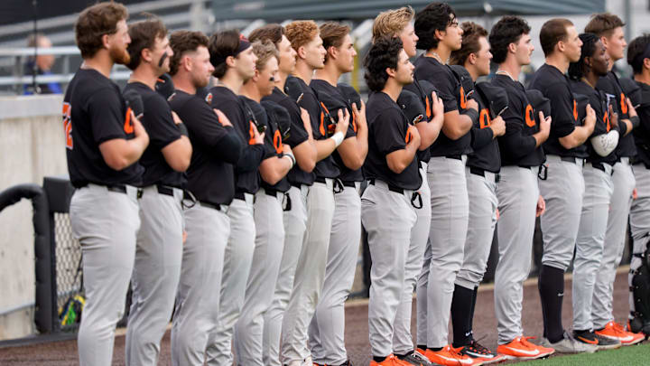 Oregon State players stand for the anthem as the Oregon Ducks host the Oregon State Beavers on March 3, 2026, at PK Park in Eugene, Oregon.