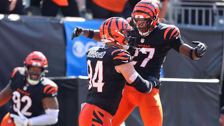 Oct 6, 2024; Cincinnati, Ohio, USA; Cincinnati Bengals defensive end Sam Hubbard (94) celebrates a safety with safety Jordan Battle (27) during the first half against the Baltimore Ravens at Paycor Stadium. Mandatory Credit: Joseph Maiorana-Imagn Images