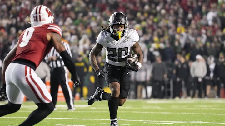 Nov 16, 2024; Madison, Wisconsin, USA;  Oregon Ducks running back Jordan James (20) during the game against the Wisconsin Badgers at Camp Randall Stadium. Mandatory Credit: Jeff Hanisch-Imagn Images