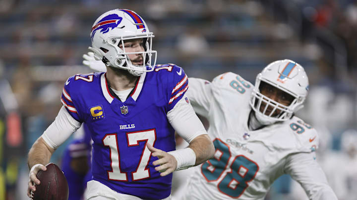 Jan 7, 2024; Miami Gardens, Florida, USA; Buffalo Bills quarterback Josh Allen (17) runs with the football against the Miami Dolphins during the second quarter at Hard Rock Stadium. Mandatory Credit: Sam Navarro-Imagn Images