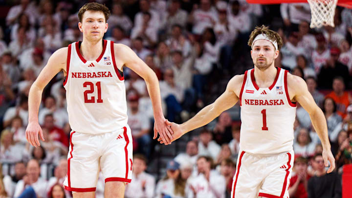 Pryce Sandfort and guard Sam Hoiberg celebrate after a three-point shot against the Illinois Fighting Illini.
