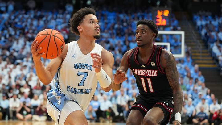 Feb 23, 2026; Chapel Hill, North Carolina, USA; North Carolina Tar Heels guard Seth Trimble (7) dribbles as Louisville Cardinals guard Kobe Rodgers (11) defends in the second half at Dean E. Smith Center. Mandatory Credit: Bob Donnan-Imagn Images Feb 23, 2026; Chapel Hill, North Carolina, USA; North Carolina Tar Heels guard Seth Trimble (7) dribbles as Louisville Cardinals guard Kobe Rodgers (11) defends in the second half at Dean E. Smith Center. Mandatory Credit: Bob Donnan-Imagn Images