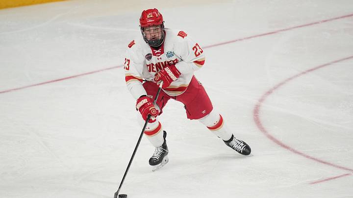 Apr 11, 2026; Las Vegas, Nevada, United States; Denver Pioneers defenseman Eric Pohlkamp (23) skates up the ice with the puck during the first period against the Wisconsin Badgers in the championship game of the NCAA men's ice hockey Frozen Four at T-Mobile Arena. Mandatory Credit: Lucas Peltier-Imagn Images Apr 11, 2026; Las Vegas, Nevada, United States; Denver Pioneers defenseman Eric Pohlkamp (23) skates up the ice with the puck during the first period against the Wisconsin Badgers in the championship game of the NCAA men's ice hockey Frozen Four at T-Mobile Arena. Mandatory Credit: Lucas Peltier-Imagn Images