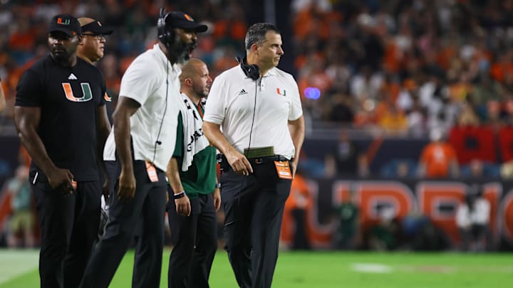Sep 27, 2024; Miami Gardens, Florida, USA; Miami Hurricanes head coach Mario Cristobal looks on from the sideline against the Virginia Tech Hokies during the third quarter at Hard Rock Stadium. Mandatory Credit: Sam Navarro-Imagn Images