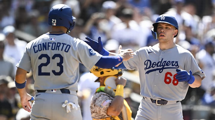 Aug 24, 2025; San Diego, California, USA; Los Angeles Dodgers catcher Dalton Rushing (68) is congratulated by  Michael Conforto (23) after hitting a three-run home run during the seventh inning against the San Diego Padres at Petco Park. Mandatory Credit: Denis Poroy-Imagn Images