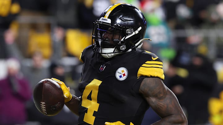 Dec 15, 2025; Pittsburgh, Pennsylvania, USA; Pittsburgh Steelers wide receiver DK Metcalf (4) scores a touchdown in the third quarter against the Miami Dolphins at Acrisure Stadium. Mandatory Credit: Charles LeClaire-Imagn Images