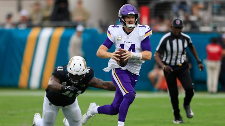 Minnesota Vikings quarterback Sam Darnold (14) is pressured by Jacksonville Jaguars defensive end Josh Hines-Allen (41) during the second quarter an NFL football matchup Sunday, Nov. 10, 2024 at Everbank Stadium in Jacksonville, Fla. Minnesota Vikings quarterback Sam Darnold (14) is pressured by Jacksonville Jaguars defensive end Josh Hines-Allen (41) during the second quarter an NFL football matchup Sunday, Nov. 10, 2024 at Everbank Stadium in Jacksonville, Fla.