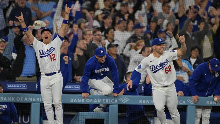 Apr 10, 2026; Los Angeles, California, USA; Los Angeles Dodgers right fielder Alex Call (12), second baseman Tommy Edman (25) and catcher Dalton Rushing (68) run out of the dugout to celebrate a walk-off solo home run by third baseman Max Muncy (13) in the ninth inning to defeat the Texas Rangers at Dodger Stadium. Mandatory Credit: Jayne Kamin-Oncea-Imagn Images