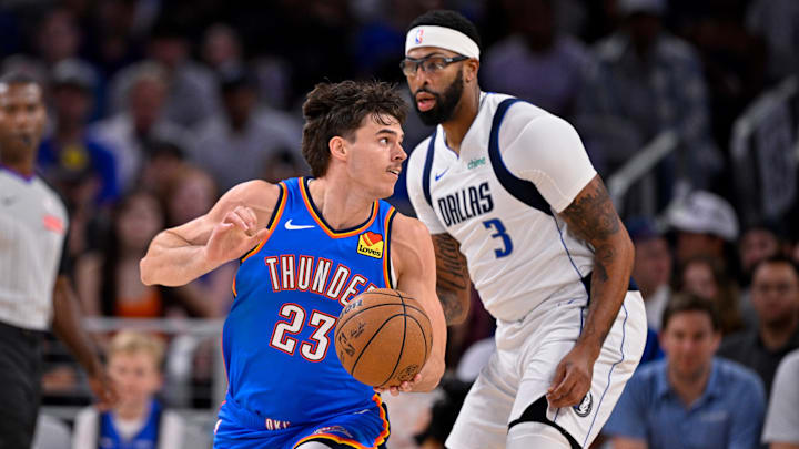 Oct 6, 2025; Fort Worth, Texas, USA; Oklahoma City Thunder guard Brooks Barnhizer (23) moves the ball past Dallas Mavericks forward/center Anthony Davis (3) during the game between the Dallas Mavericks and the Oklahoma City Thunder at Dickie's Arena. Oct 6, 2025; Fort Worth, Texas, USA; Oklahoma City Thunder guard Brooks Barnhizer (23) moves the ball past Dallas Mavericks forward/center Anthony Davis (3) during the game between the Dallas Mavericks and the Oklahoma City Thunder at Dickie's Arena.