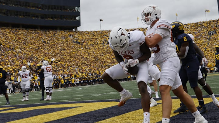 Longhorns running back Jerrick Gibson celebrates after scoring in the first half against the Michigan Wolverines at Michigan Stadium. Longhorns running back Jerrick Gibson celebrates after scoring in the first half against the Michigan Wolverines at Michigan Stadium.